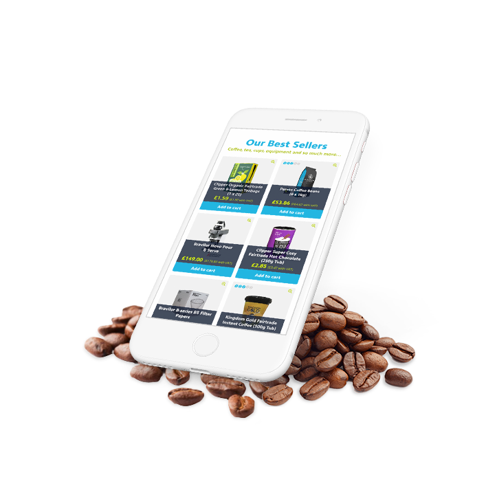 Phone displaying kingdom coffee website design, at on coffee beans