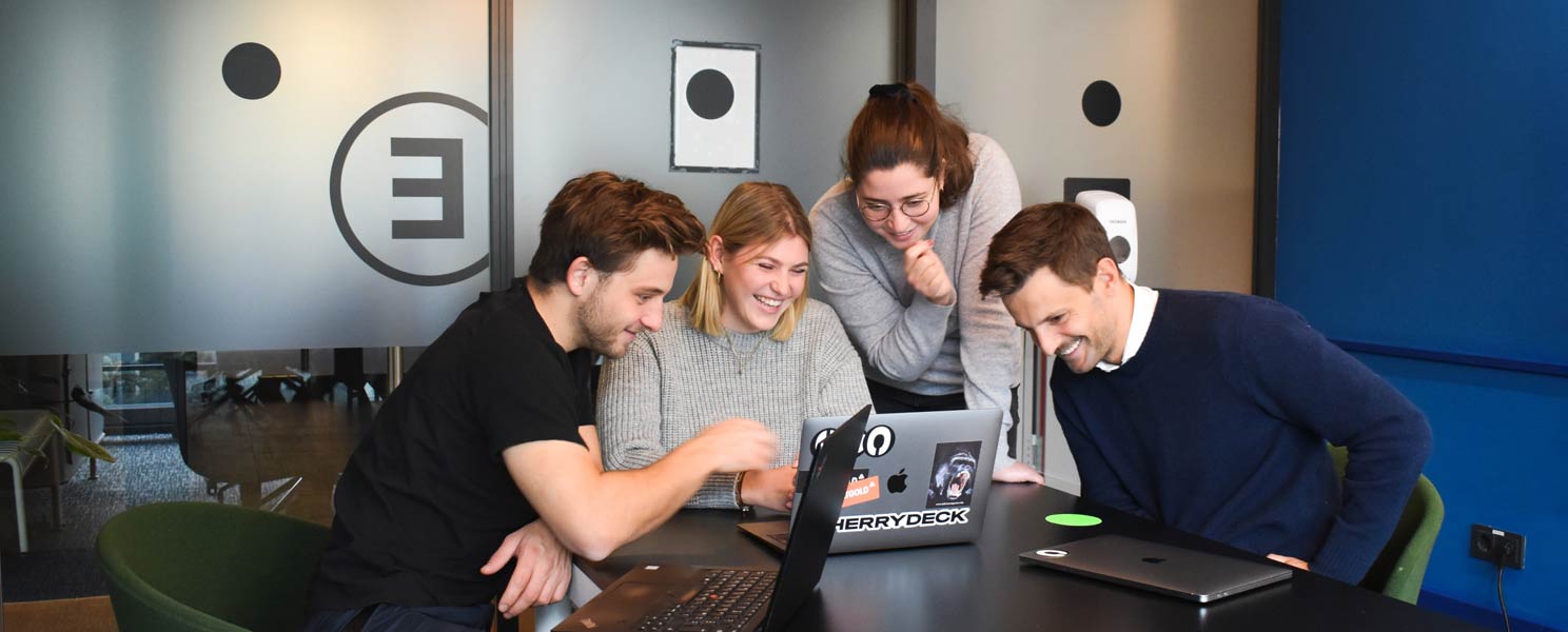 a team working together on one computer