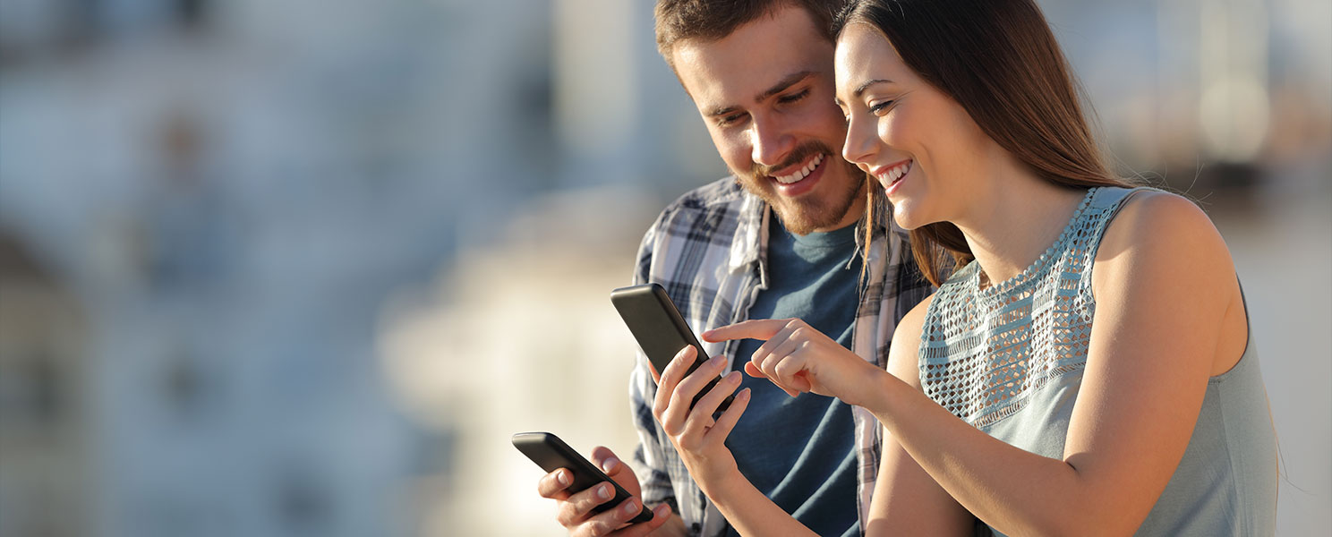 a couple looking at content on a phone 