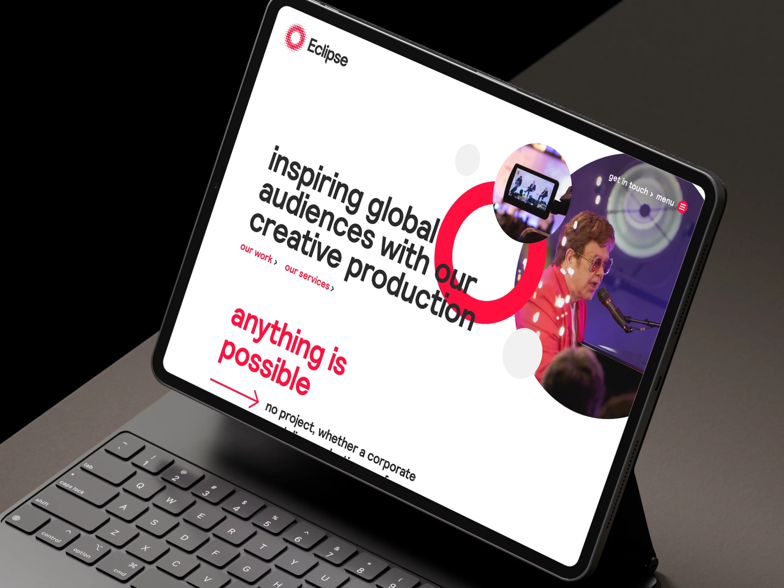 A bold digital thumbnail featuring the Eclipse logo and vibrant event production imagery on the Above Digital's website design, showcasing creative technical solutions for global brands on a laptop.
