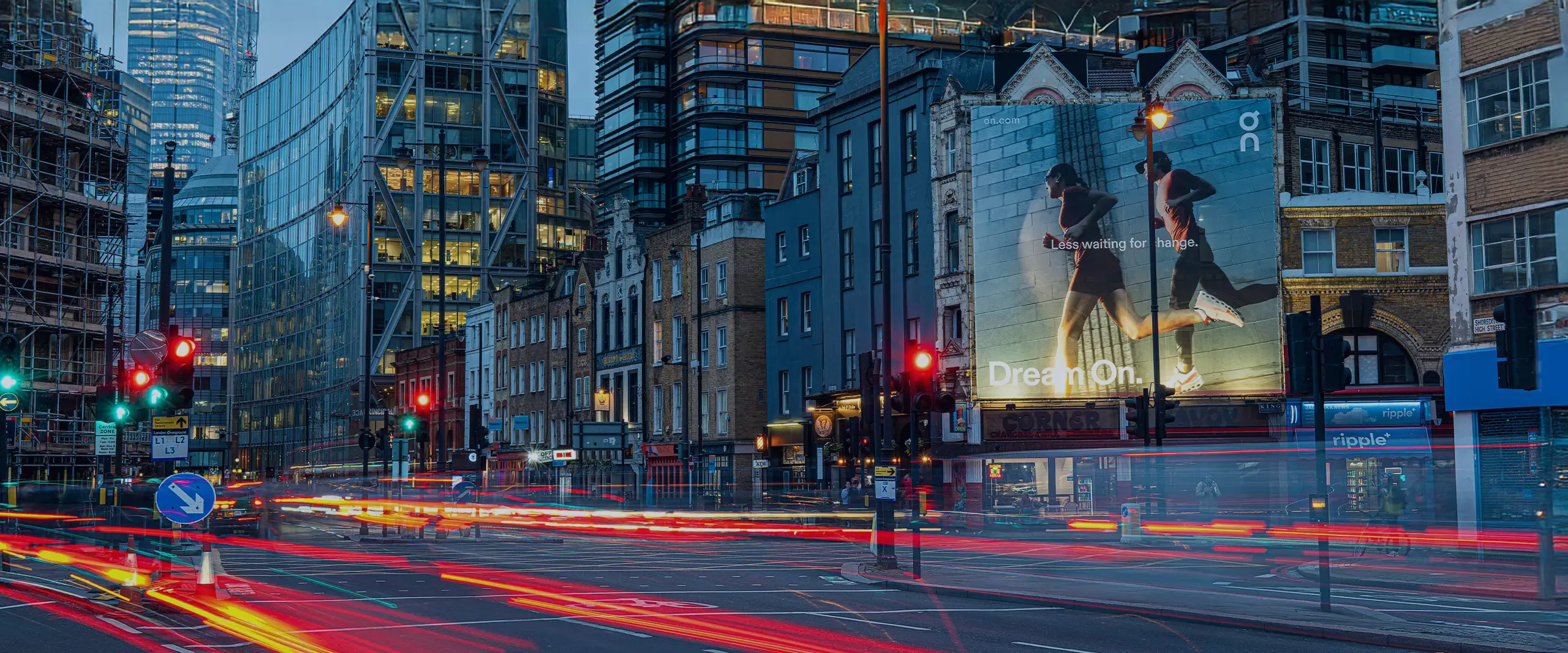 Billboard advertising Maximus client “On” on a busy street