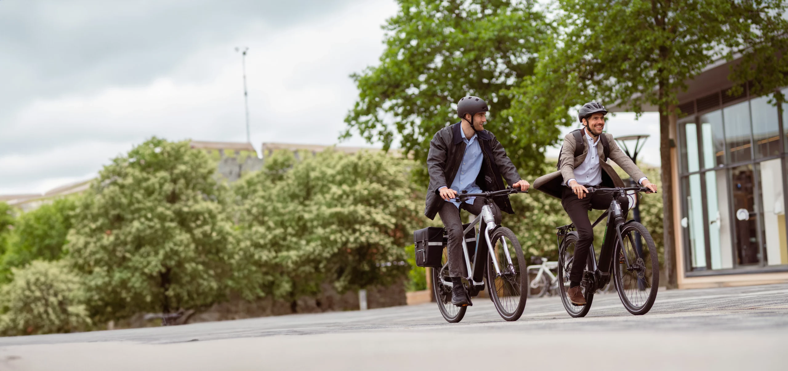 Two commuters cycling EBCO e-bikes to work, from on-location photoshoot by Above Digital