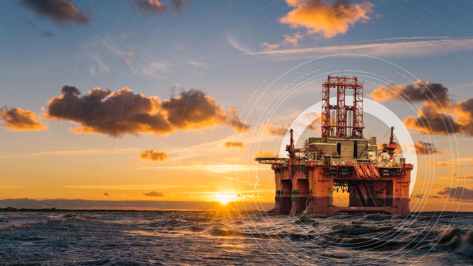 Argus Media branding focus circle over image of an oil rig at sea as the sun sets