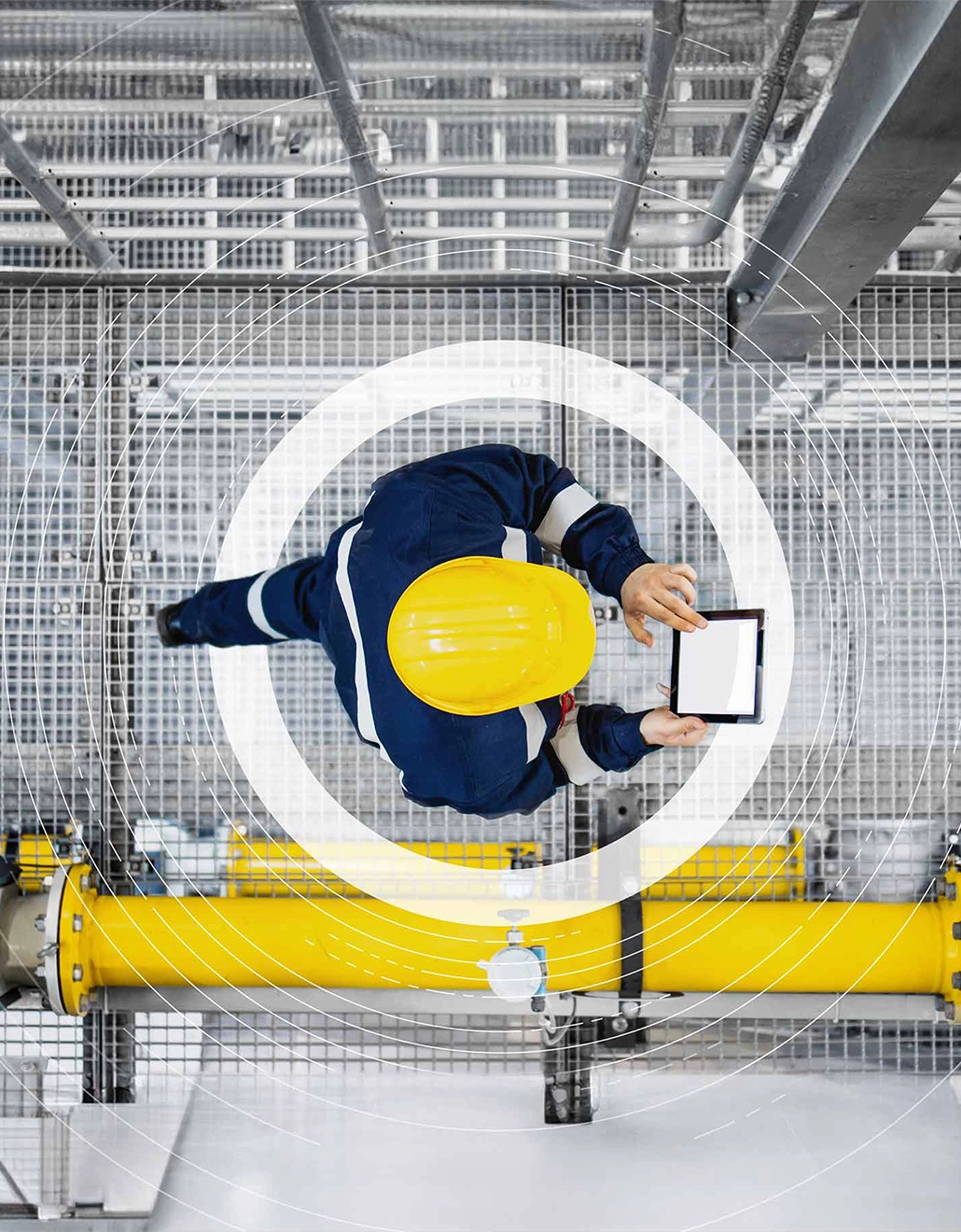 Argus Media branding focus circle over image of fuels manufacturer wearing a hard hat