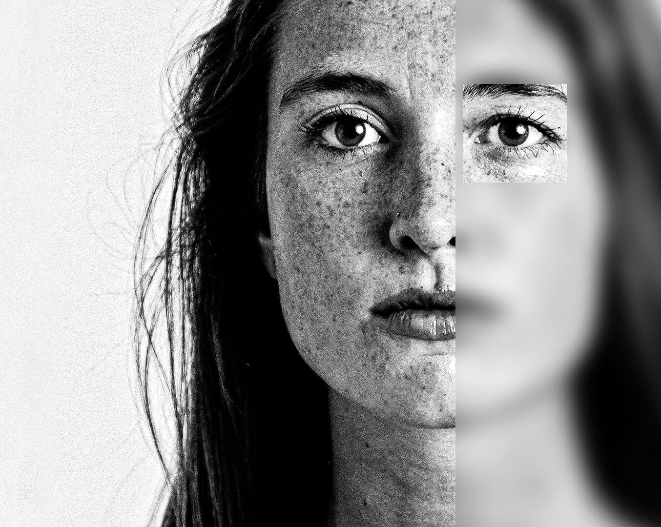 Black and white portrait of a woman's face, with the right side in sharp focus and the left side heavily blurred, except for a small sharp square revealing her eye.